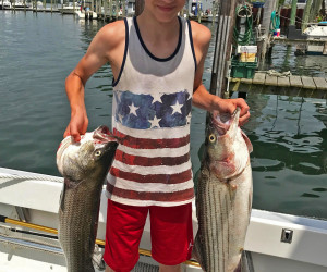 Kids out stiped bass fishing with Southbound Fishing Charters out of Waterford, CT
